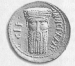 Рис. 31. Голова архаического Диониса или Баала на монете Синопы. Римское время